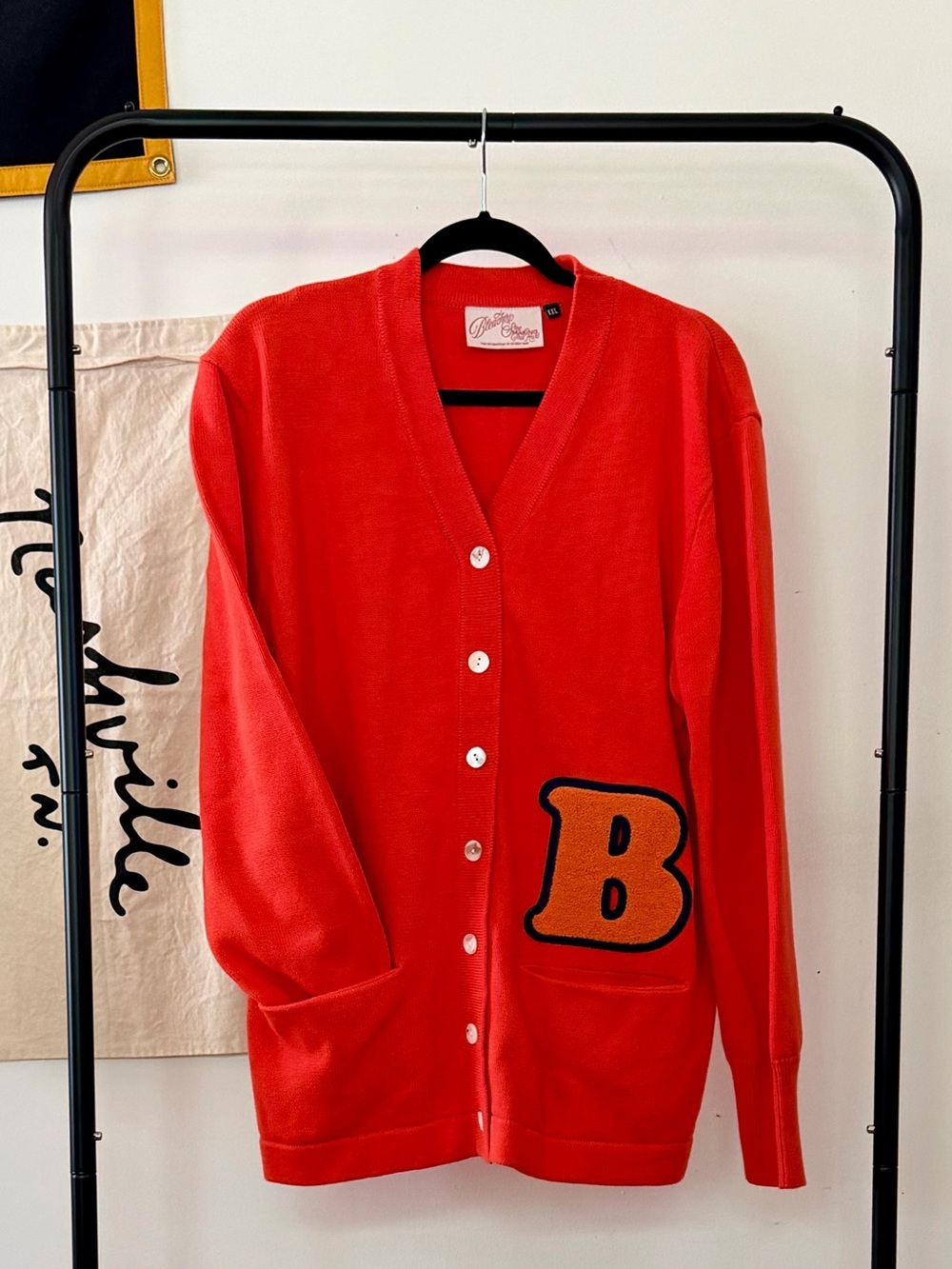 Bright Orange V-Neck Button Cardigan with 'B' Patch